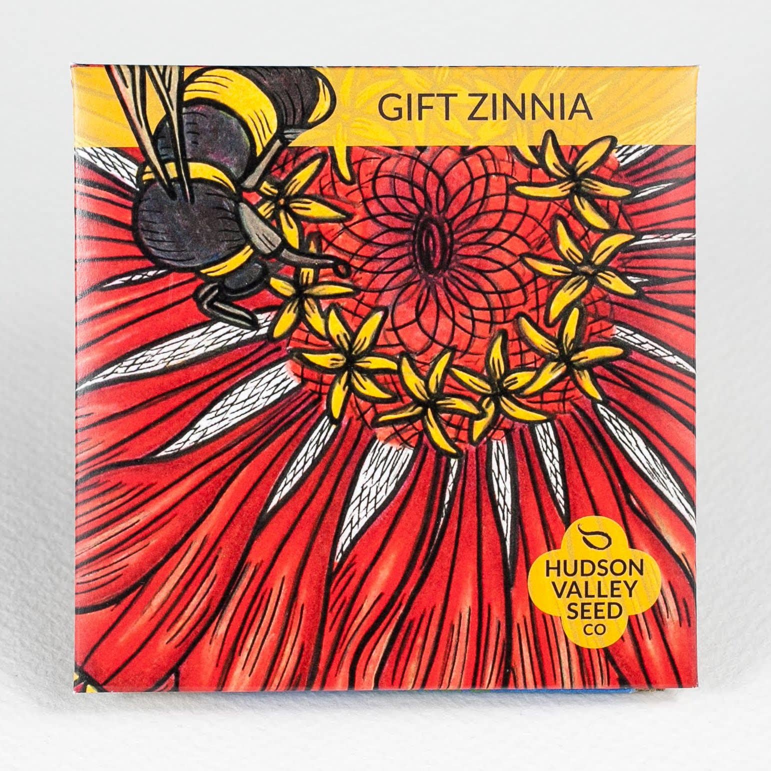 Gift Zinnia packaging with a bee and flower design, featuring Hudson Valley Seed Co.