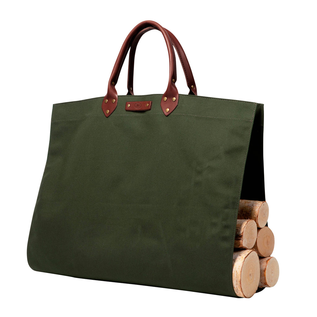 Green tote bag with brown handles holding wooden logs on a white background